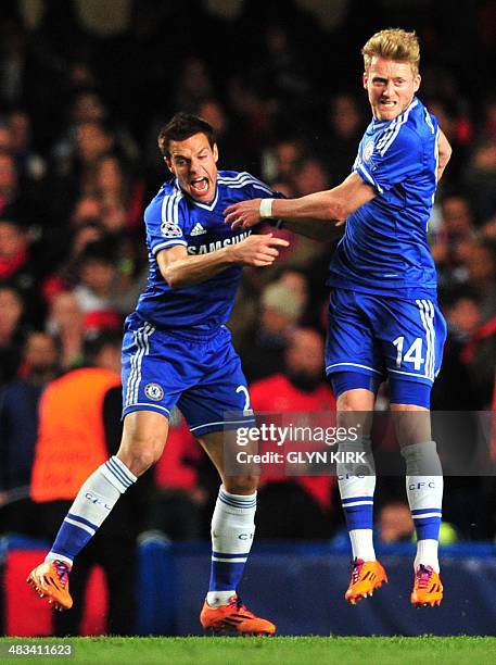 Chelsea's German striker Andre Schurrle celebrates scoring the opening goal with Chelsea's Spanish defender Cesar Azpilicueta during the UEFA...