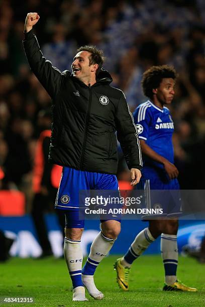 Chelsea's English midfielder Frank Lampard raises his fist in celebration after the final whistle during the UEFA Champions League quarter final...