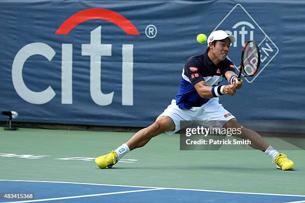 Kei Nishikori of Japan returns a shot to Marin Cilic of Croatia during the Citi Open at Rock Creek Park Tennis Center on August 8, 2015 in...