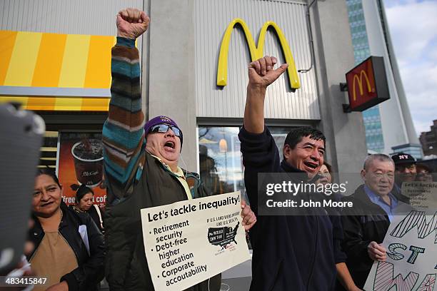 Activists chant for higher wages outside a McDonald's restaurant on April 8, 2014 in Stamford, Connecticut. Demonstrations were organized across the...