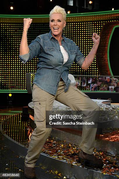 Brigitte Nielsen reacts after winning the final of the television show 'Ich bin ein Star - lasst mich wieder rein!' on August 8, 2015 in Huerth,...