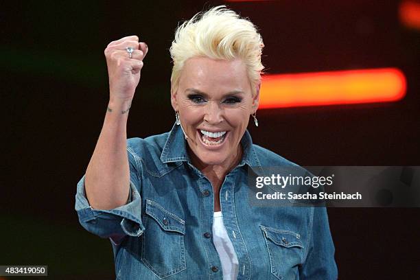 Brigitte Nielsen reacts after winning the final of the television show 'Ich bin ein Star - lasst mich wieder rein!' on August 8, 2015 in Huerth,...