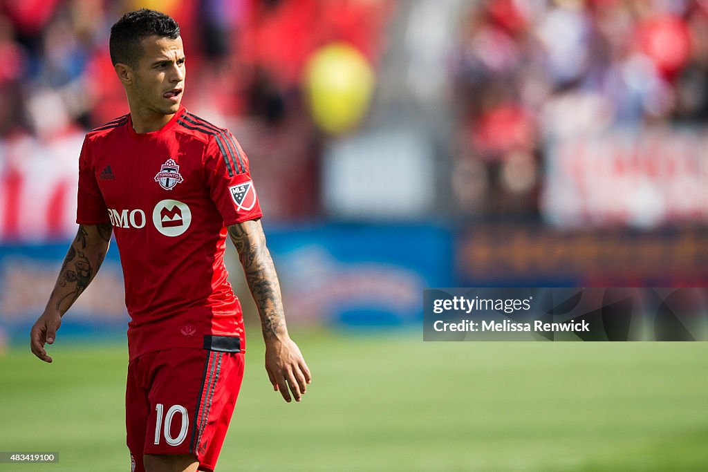 Midfielder, Sebastian Giovinco, looks to the play during the first half action of MLS season play between Toronto FC and Sporting Kansas City at the BMO Field in Toronto.