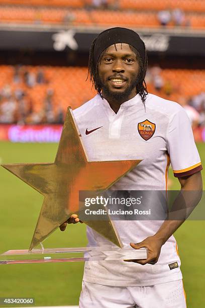 Roma player Gervinho with the trophy for best player after the pre-season friendly match between Valencia CF and AS Roma at Estadio Mestalla on...