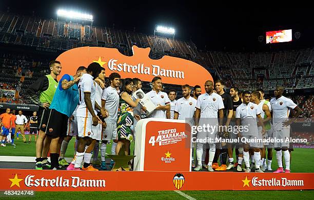 Roma players receiving the trophy at the end of the pre-season friendly match between Valencia CF and AS Roma at Estadio Mestalla on August 8, 2015...