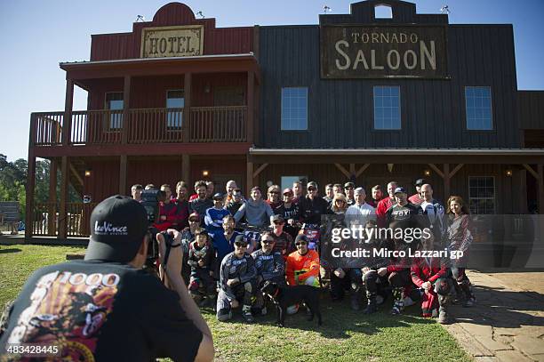 Colin Edwards of USA and NGM Mobile Forward Racing and friends pose for photographers during the "Meeting with friends and Colin Edwards of USA" in...