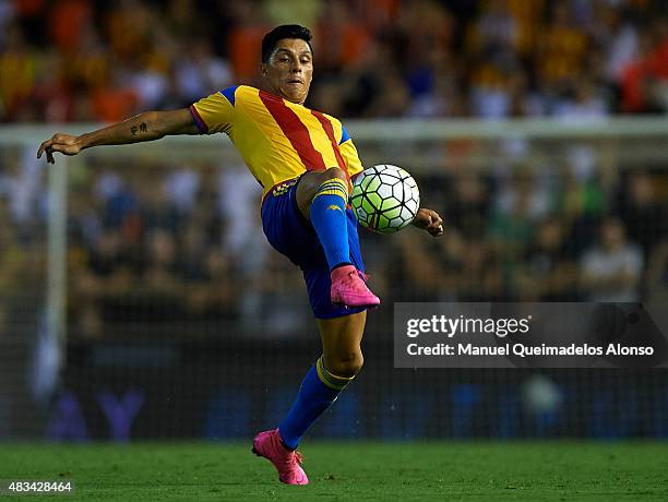 Enzo Perez of Valencia in action during the pre-season friendly match between Valencia CF and AS Roma at Estadio Mestalla on August 8, 2015 in...