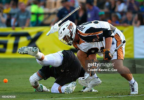Greg Gurenlian of the New York Lizards is upended in a faceoff against Mike Poppleton of the Rochester Rattlers during the 2015 Major League Lacrosse...
