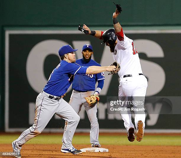 Mike Napoli of the Boston Red Sox is tagged out by Donnie Murphy of the Texas Rangers on a fielder's choice hit by Grady Sizemore of the Boston Red...