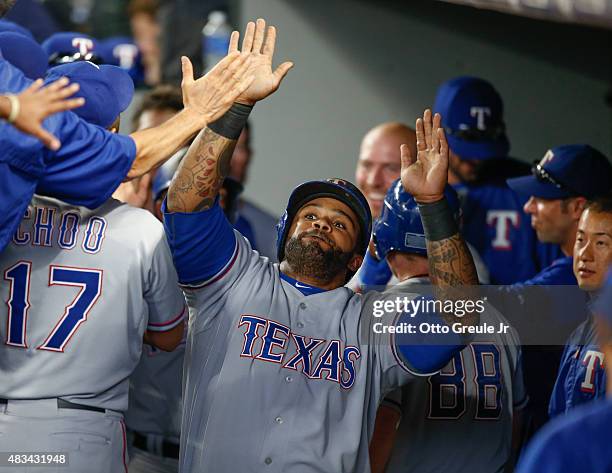 Prince Fielder of the Texas Rangers is congratulated by teammates after hitting a two-run home run to take an 11-3 lead against the Seattle Mariners...