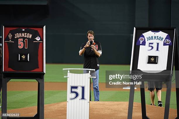 Former Arizona Diamondbacks pitcher Randy Johnson takes a picture looking in from behind the pitchers mound prior to a game against the Cincinnati...