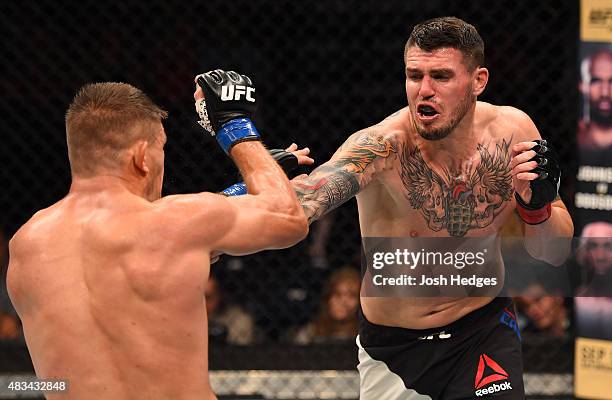 Chris Camozzi punches Tom Watson of England in their middleweight bout during the UFC Fight Night event at Bridgestone Arena on August 8, 2015 in...