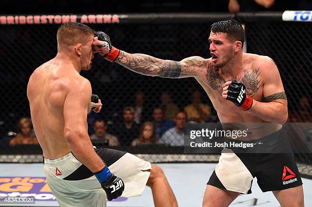 Chris Camozzi punches Tom Watson of England in their middleweight bout during the UFC Fight Night event at Bridgestone Arena on August 8, 2015 in...