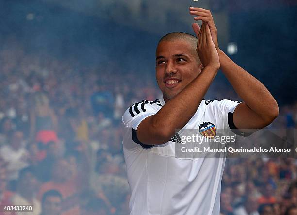 Sofiane Feghouli of Valencia waves during the team official presentation ahead the pre-season friendly match between Valencia CF and AS Roma at...