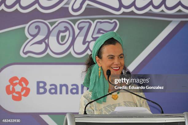 Maria Isabel Grañen speaks during Home Runs Banamex donations at Eduardo Vasconcelos Stadium during a match between Tigres de Quintana Roo and...