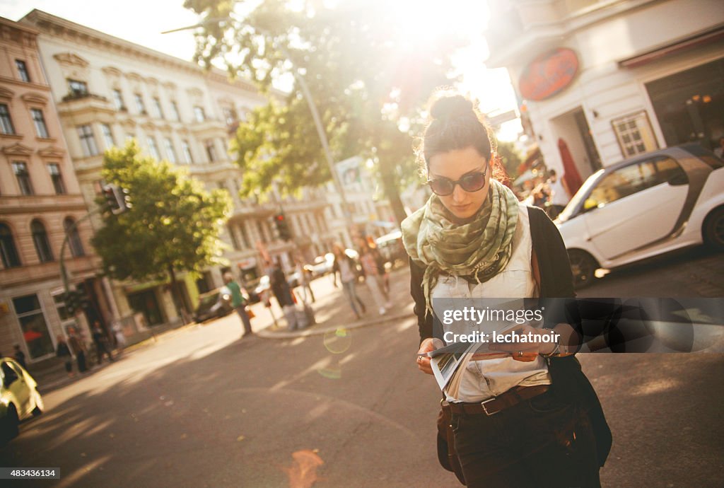 Female tourist walking on the street in Berlin