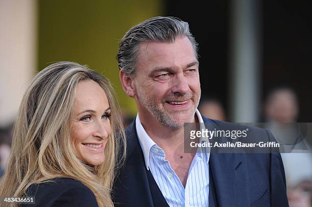Actor Ray Stevenson and Elisabetta Caraccia arrive at the Los Angeles Premiere of 'Divergent' at Regency Bruin Theatre on March 18, 2014 in Los...