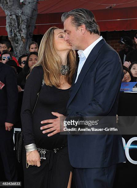 Actor Ray Stevenson and Elisabetta Caraccia arrive at the Los Angeles Premiere of 'Divergent' at Regency Bruin Theatre on March 18, 2014 in Los...