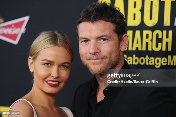 Model Lara Bingle and actor Sam Worthington arrive at the Los Angeles premiere of 'Sabotage' at Regal Cinemas L.A. Live on March 19, 2014 in Los...