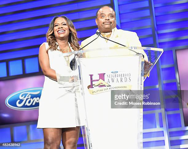 Kandi Burruss and Roland Martin speak at the 2015 Ford Neighborhood Awards Hosted By Steve Harvey at Phillips Arena on August 8, 2015 in Atlanta,...