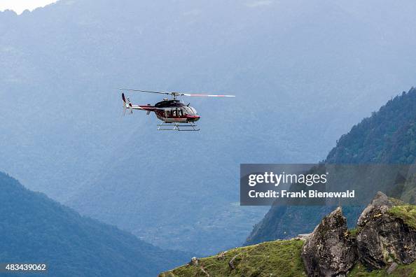 A helicopter is flying close to the surface through the A helicopter is flying close to the surface through the