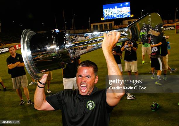 Head coach Joe Spallina of the New York Lizards celebrates with the trophy after their 15-12 win over the Rochester Rattlers during the 2015 Major...