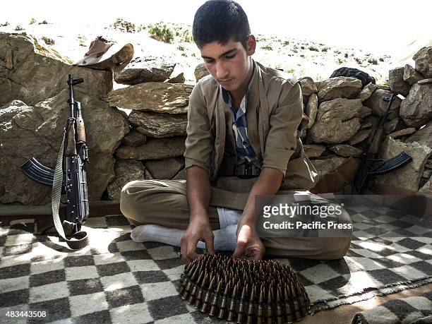Boy arranged his bullets. The PDKI movement is in Iranian borders, one kilometer away from the Iranian troops and where the Peshmerga stays.