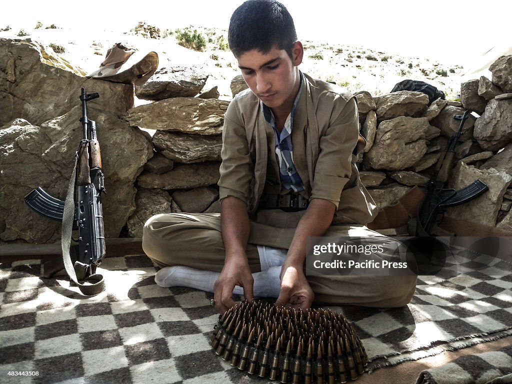A boy arranged his bullets. The PDKI movement is in Iranian...