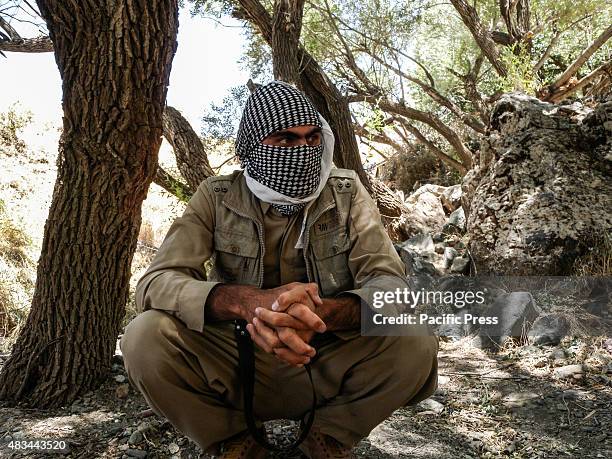 Man covers his face. The PDKI movement is in Iranian borders, one kilometer away from the Iranian troops and where the Peshmerga stays.
