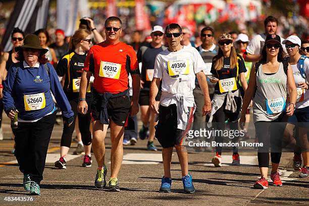 Participants run during the 2015 City To Surf race on August 9, 2015 in Sydney, Australia.