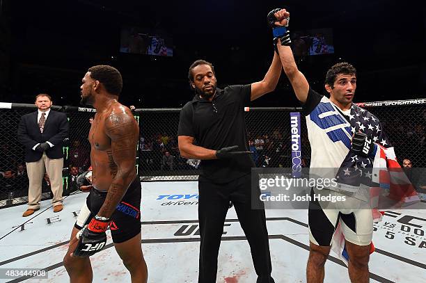 Beneil Dariush celebrates after defeating Michael Johnson in their lightweight bout during the UFC Fight Night event at Bridgestone Arena on August...