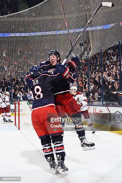 Ryan Johansen of the Columbus Blue Jackets celebrates his game-winning overtime goal with teammate Boone Jenner in a game against the Phoenix Coyotes...