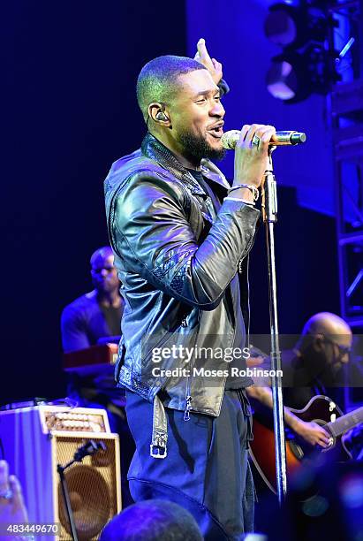 Usher performs at the 2015 Ford Neighborhood Awards Hosted By Steve Harvey at Phillips Arena on August 8, 2015 in Atlanta, Georgia.