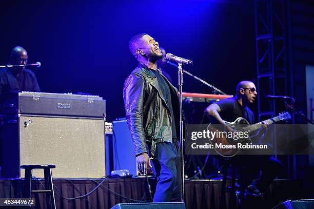 Usher performs at the 2015 Ford Neighborhood Awards Hosted By Steve Harvey at Phillips Arena on August 8, 2015 in Atlanta, Georgia.