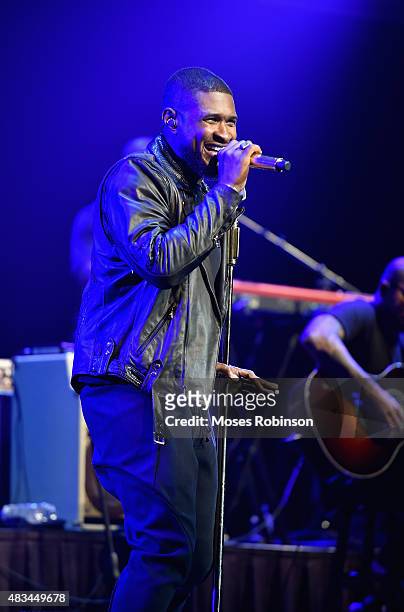 Usher performs at the 2015 Ford Neighborhood Awards Hosted By Steve Harvey at Phillips Arena on August 8, 2015 in Atlanta, Georgia.