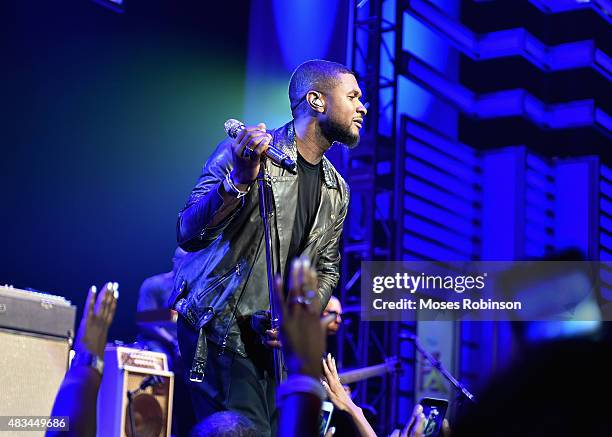 Usher performs at the 2015 Ford Neighborhood Awards Hosted By Steve Harvey at Phillips Arena on August 8, 2015 in Atlanta, Georgia.