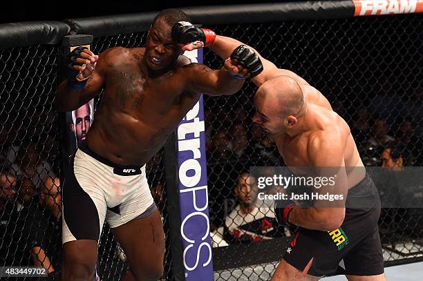Glover Teixeira of Brazil punches Ovince Saint Preux in their light heavyweight bout during the UFC Fight Night event at Bridgestone Arena on August...