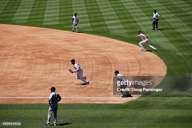 The Colorado Rockies infield employ the infield shift as they defend against the Seattle Mariners during interleague play at Coors Field on August 5,...