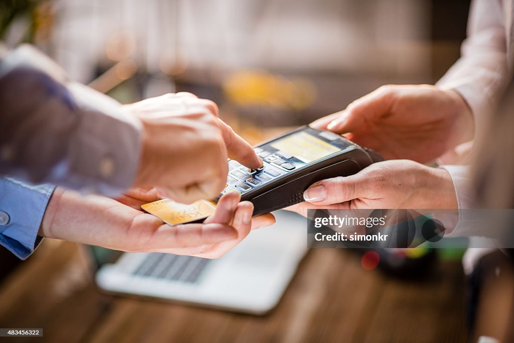 Man making credit card payment