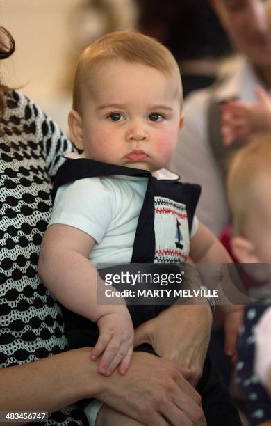 Catherine , the Duchess of Cambridge, holds Prince George during a Plunket nurse and parents group visit at Government House in Wellington on April...