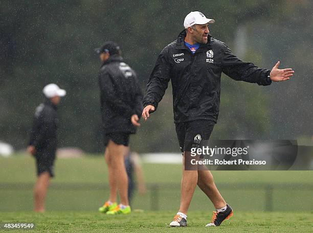 Anthony Rocca gives instructions during a Collingwood Magpies AFL training session at Olympic Park on April 9, 2014 in Melbourne, Australia.