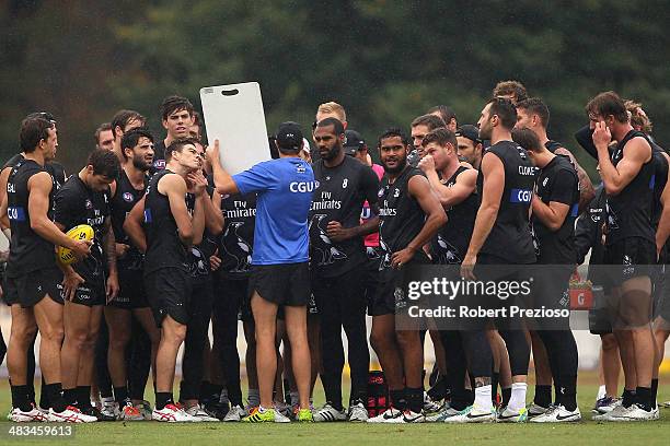 Forward coach Matthew Lappin gives instructions during a Collingwood Magpies AFL training session at Olympic Park on April 9, 2014 in Melbourne,...