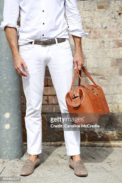 Stylist Jeff Lack wearing Persol sunglasses, vintage bag, Acme pants, Brad Wilson shirt and Aquila shoes at Mercedes-Benz Fashion Week Australia 2014...