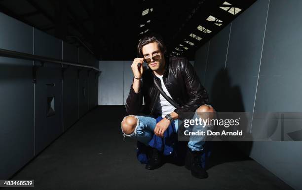 Jordan Stenmark wears Zegna jacket, Ralph Lauren t-shirt, Tom Ford glasses and Lee jeans at Mercedes-Benz Fashion Week Australia 2014 at...