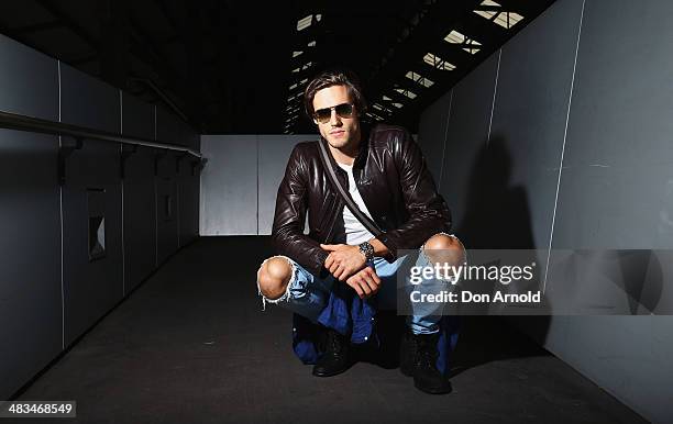 Jordan Stenmark wears Zegna jacket, Ralph Lauren t-shirt, Tom Ford glasses and Lee jeans at Mercedes-Benz Fashion Week Australia 2014 at...