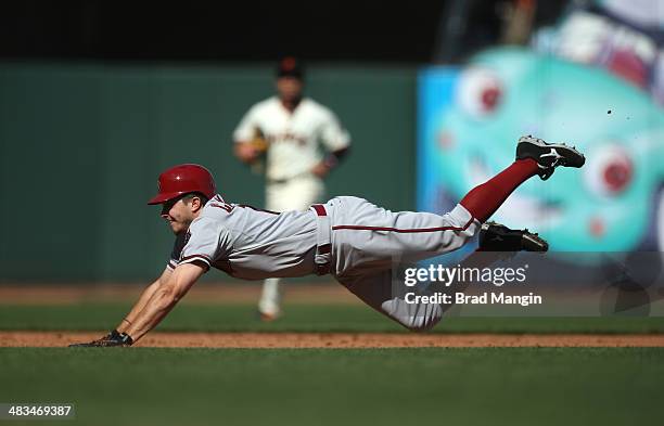 Tony Campana of the Arizona Diamondbacks slides safely into third base against the San Francisco Giants during the game at AT&T Park on Tuesday,...