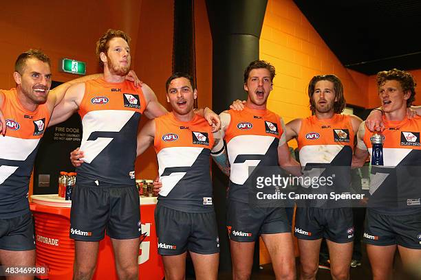 Giants players sing their team song after winning the round 19 AFL match between the Greater Western Sydney Giants and the Essendon Bombers at...
