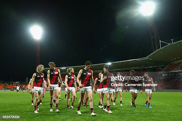 Bombers players look dejected after losing the round 19 AFL match between the Greater Western Sydney Giants and the Essendon Bombers at Spotless...
