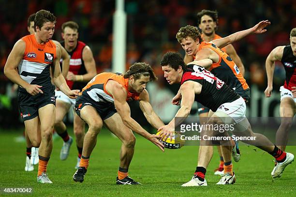 Callan Ward of the Giants and Nick O'Brien of the Bombers contest the ball during the round 19 AFL match between the Greater Western Sydney Giants...