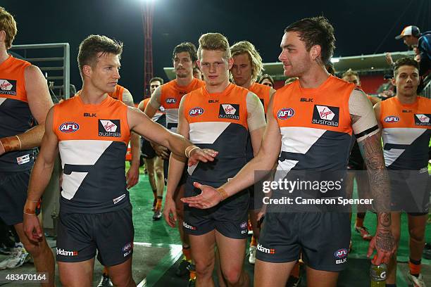 Rhys Palmer of the Giants and Nathan Wilson of the Giants congratulate each other after winning the round 19 AFL match between the Greater Western...